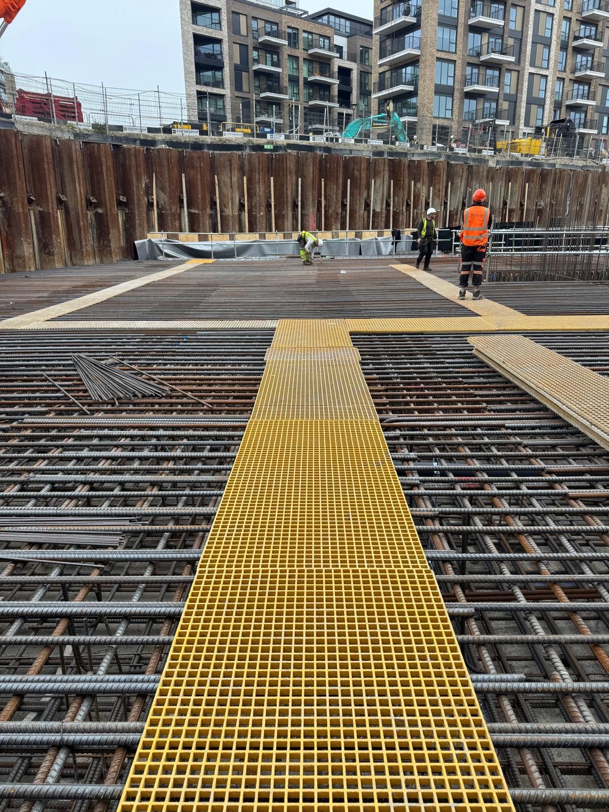 Reinforced slab with yellow safety walkway markings